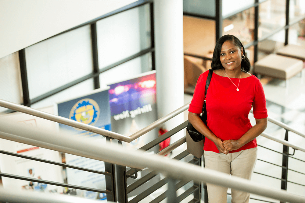 Valencia Faculty Member standing on stairs